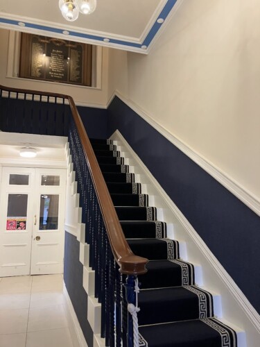 The staircase has wide, shallow steps with a good handrail